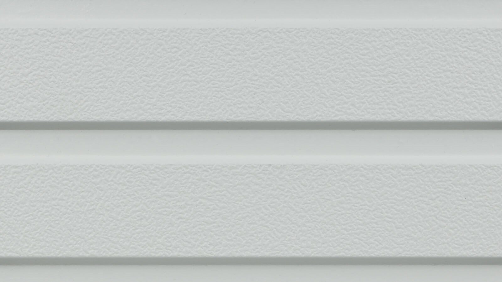 A close-up of a light gray, textured metal surface with two horizontal grooves running across it. The surface has a slightly bumpy texture, and the grooves create a subtle contrast in the material.