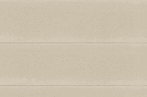 A close-up view of a beige, textured wall with horizontal lines. The wall has a smooth finish with slight variations in the shading, giving it a subtle, natural look.