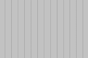 A gray, vertical planked wall with evenly spaced, thin lines. The lines create a repetitive pattern across the surface, giving the appearance of wood or paneling. The overall color is uniform and light gray.