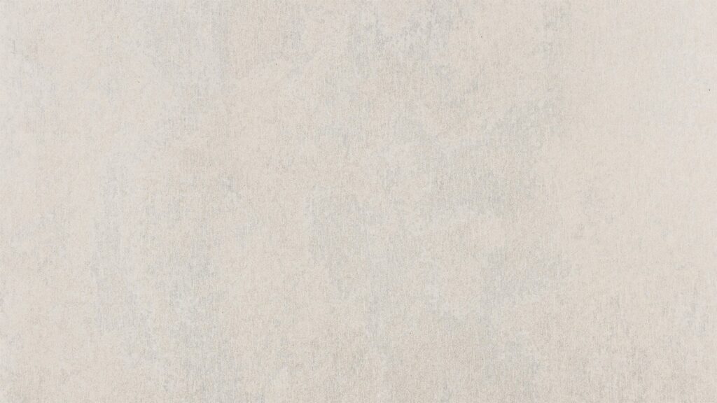 A close-up image of a smooth, light beige textured surface with subtle variations in shade. The texture appears consistent, with no distinct patterns or markings. The overall tone is neutral, lending a soft and understated look.