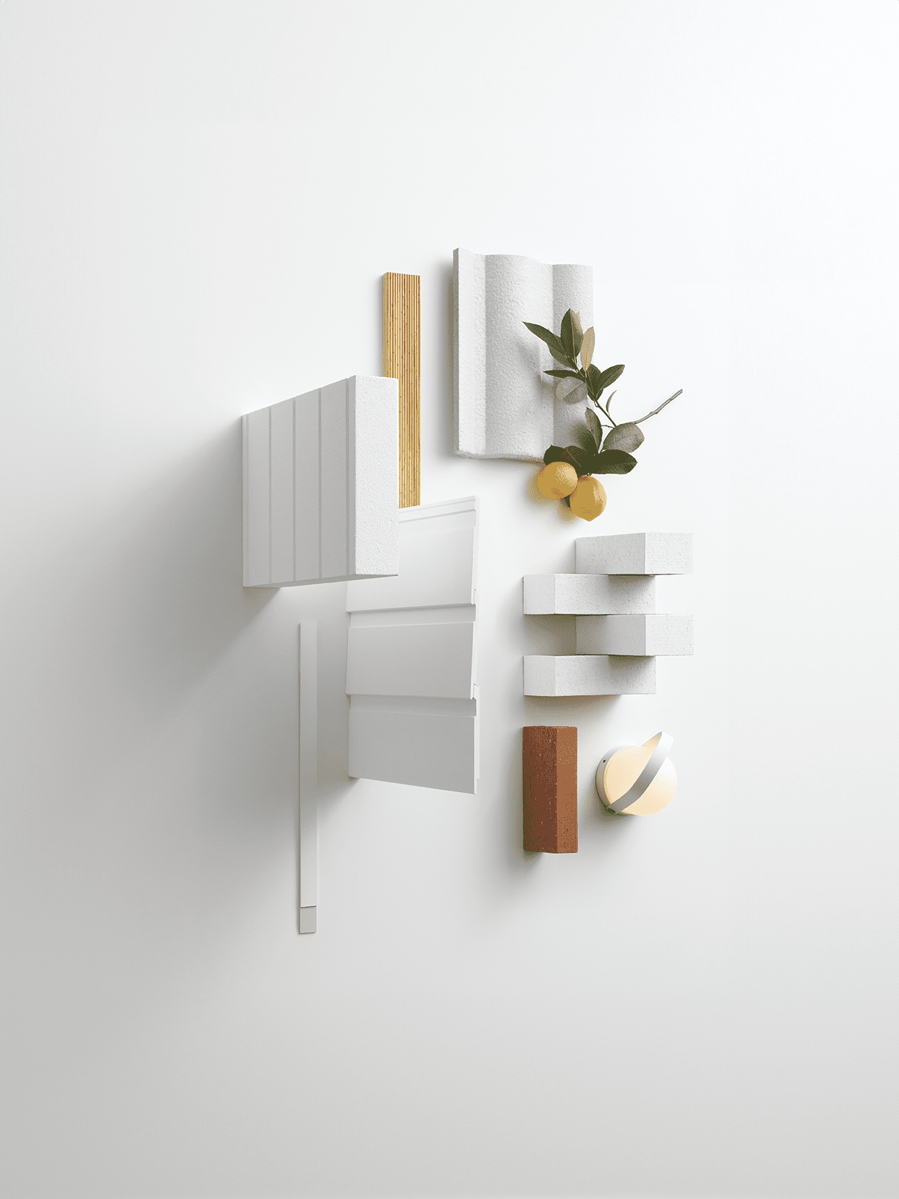 A flat lay of white and wood architectural samples, textured white fabric, small lemons with green leaves, white rectangular blocks, a red brick, and a round candle, all arranged on a white background.
