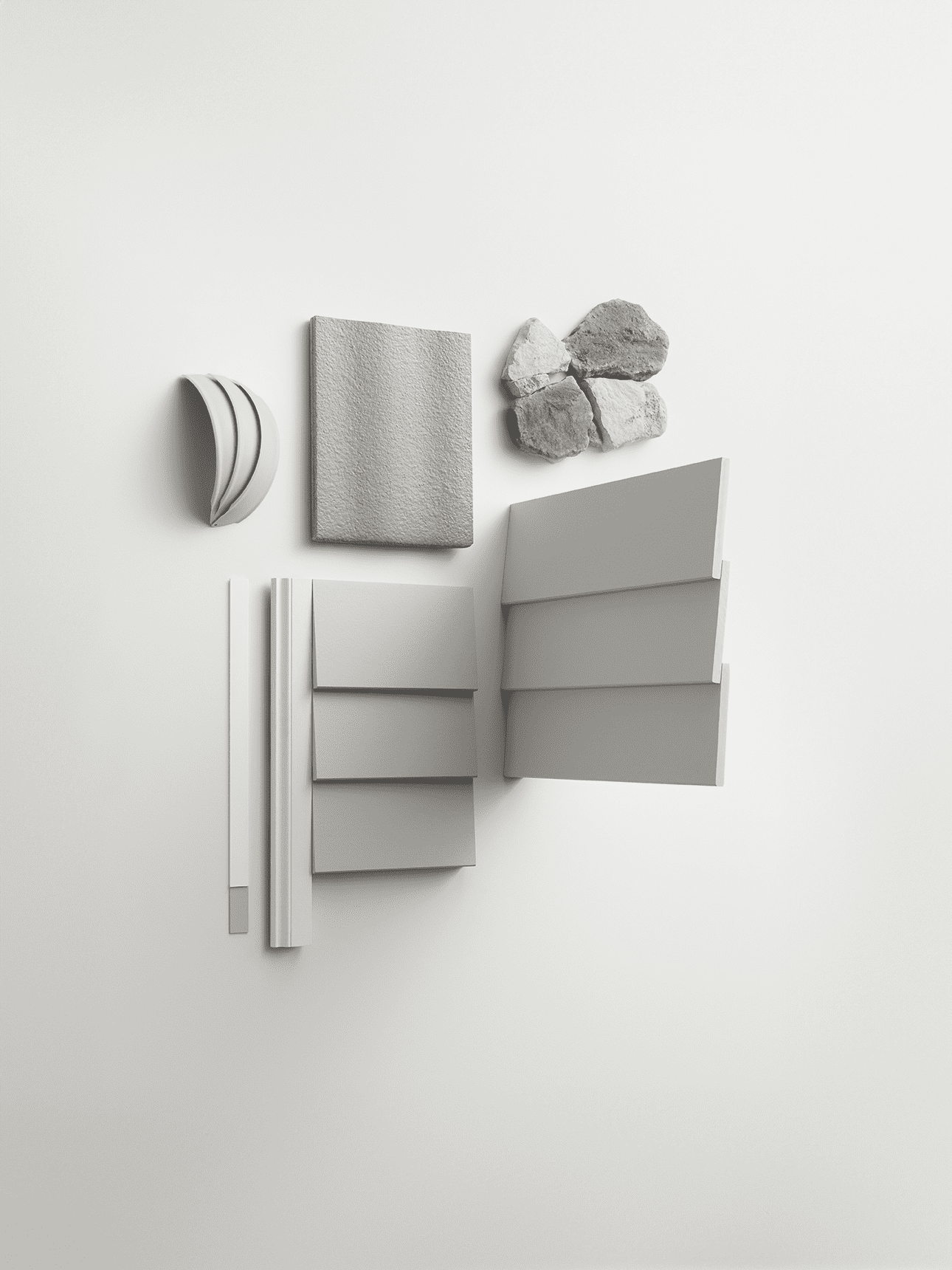 A minimalist flat lay features gray siding samples, a square light gray fabric swatch, a cluster of stones, and curved and rectangular white architectural elements on a white background.